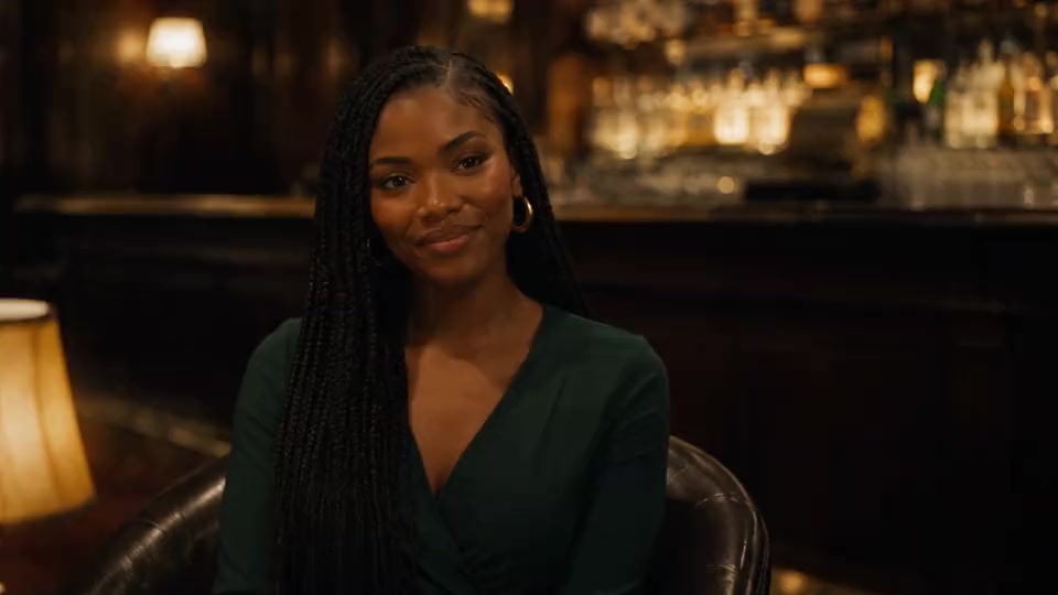 A cinematic portrait in a softly lit bar.